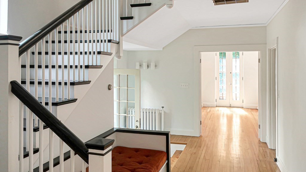 39 Locust Avenue Lexington, MA 02421 - Photo 12 of 32 a view of staircase with wooden floor and white walls
