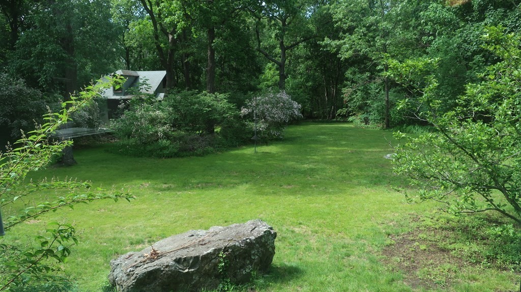 39 Locust Avenue Lexington, MA 02421 - Photo 26 of 32 a backyard of a house with a yard and outdoor seating