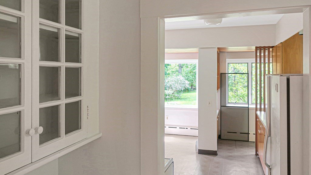 39 Locust Avenue Lexington, MA 02421 - Photo 8 of 32 a view of an empty room with a window