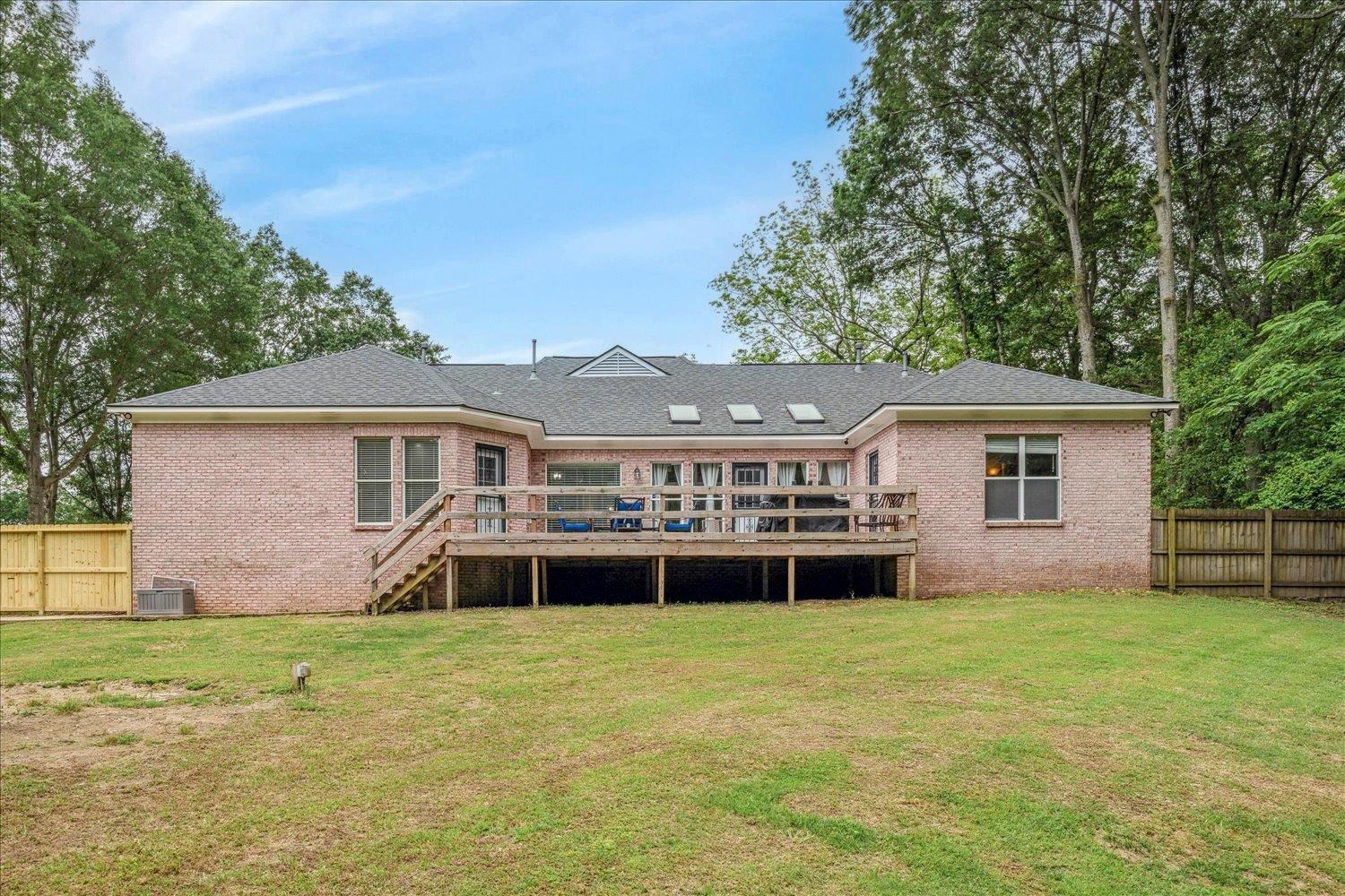5950 Benjestown Road Memphis, TN 38127 - Photo 24 of 25 Rear view of property with brick siding, a deck, stairway, and central AC unit