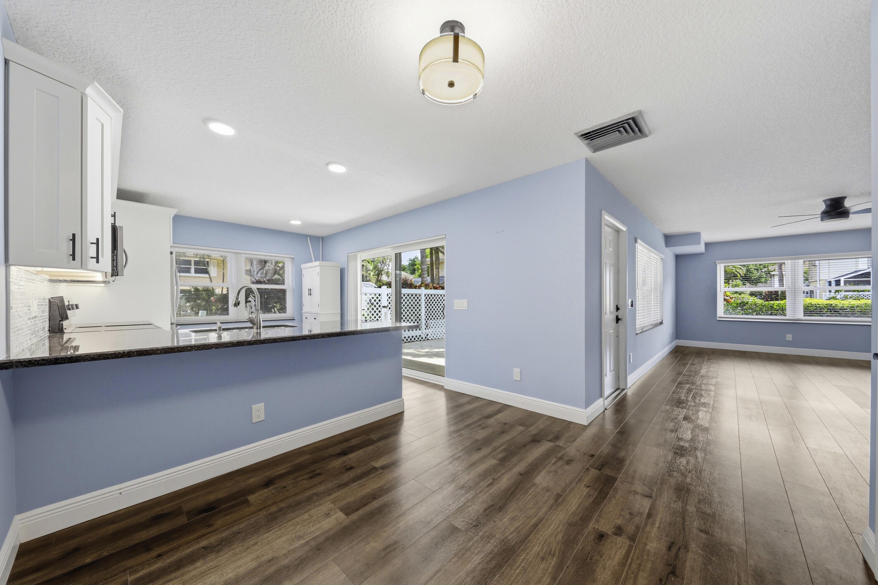 4802 Roxbury Court Boynton Beach, FL 33436 - Photo 15 of 41 a view of an empty room with wooden floor and a window