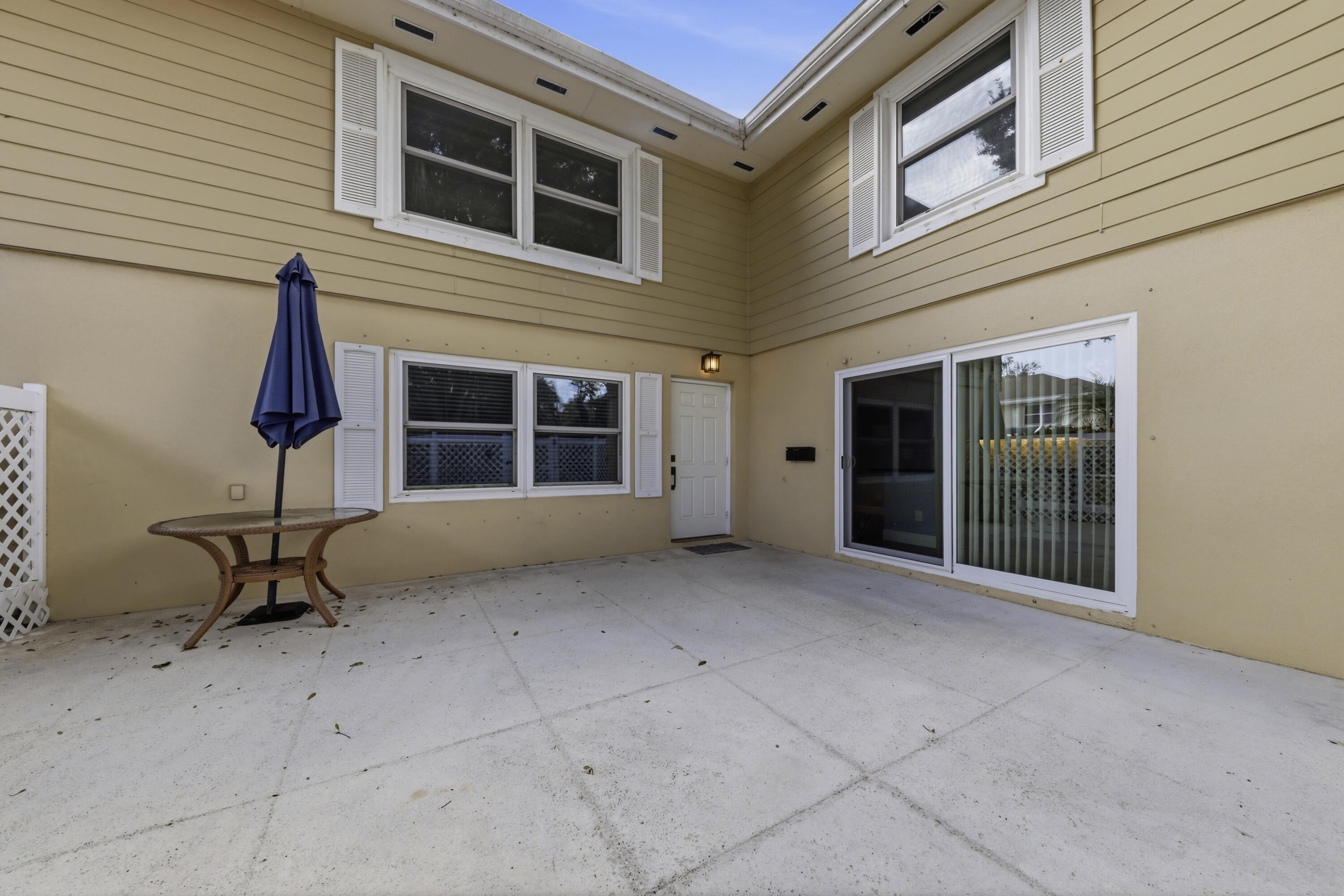 4802 Roxbury Court Boynton Beach, FL 33436 - Photo 38 of 41 a view of a house with a table and chairs