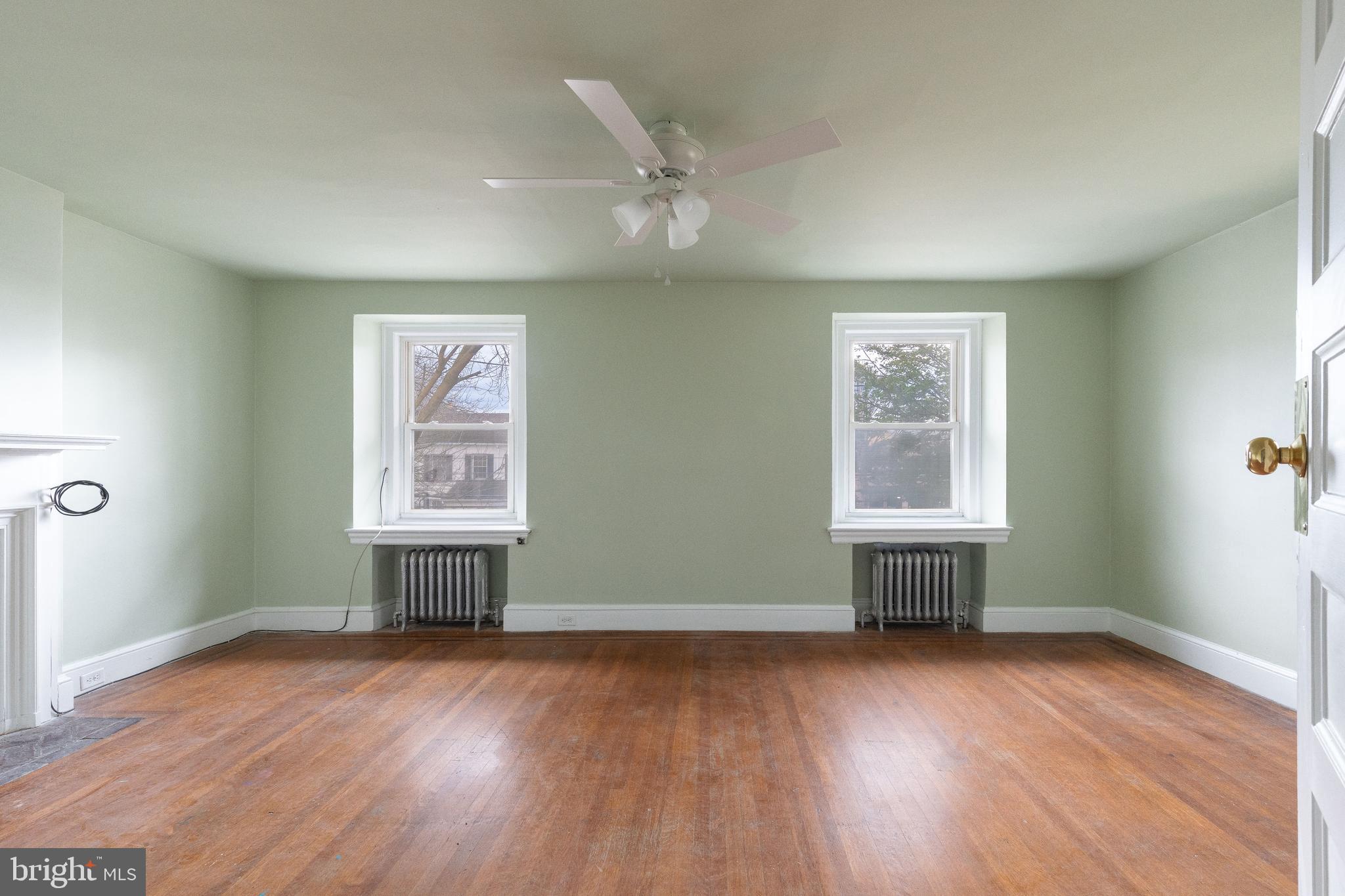 112 East Township Line Road Havertown, PA 19083 - Photo 14 of 40 an empty room with wooden floor and windows