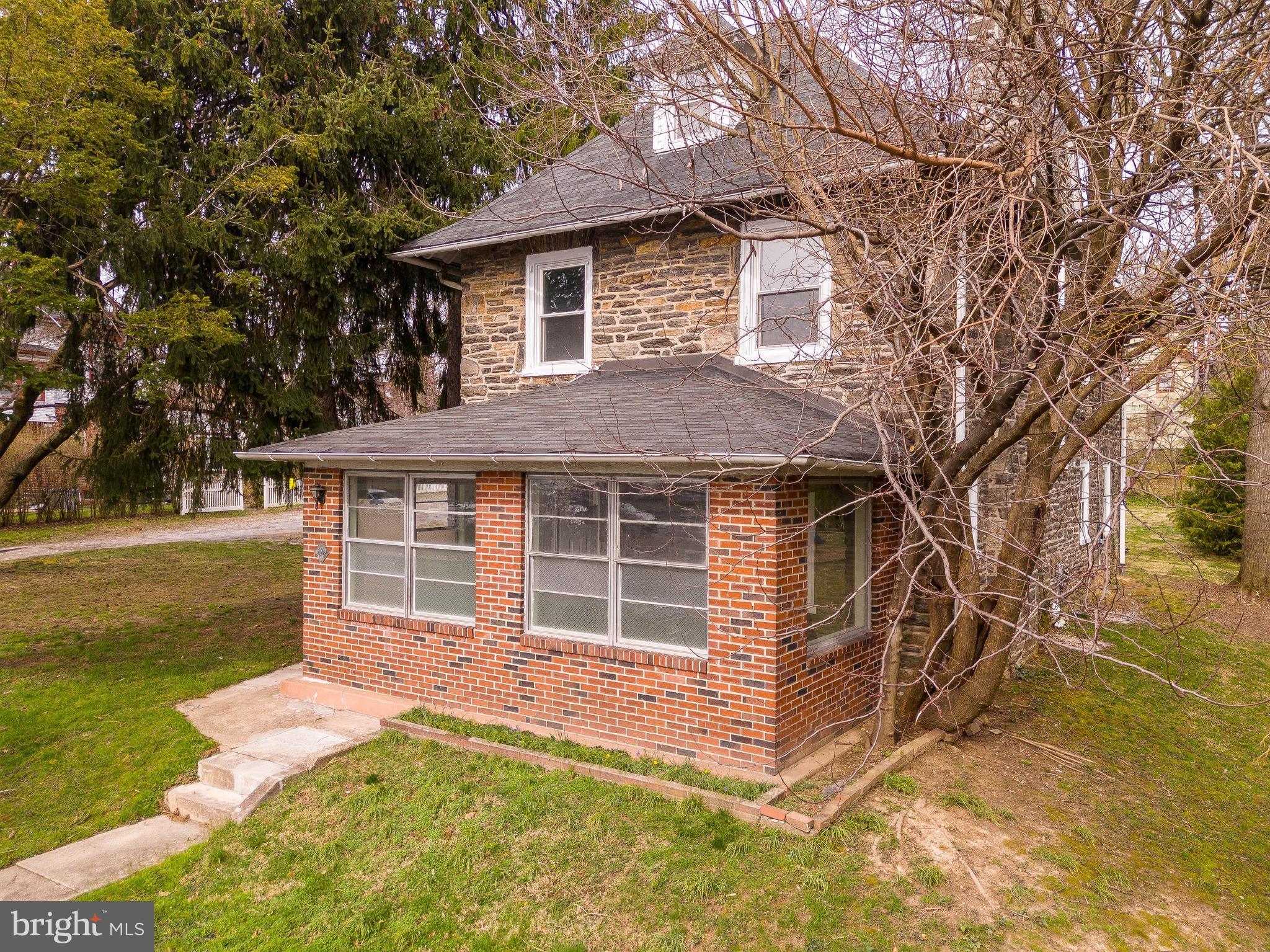 112 East Township Line Road Havertown, PA 19083 - Photo 2 of 40 a front view of a house with a yard
