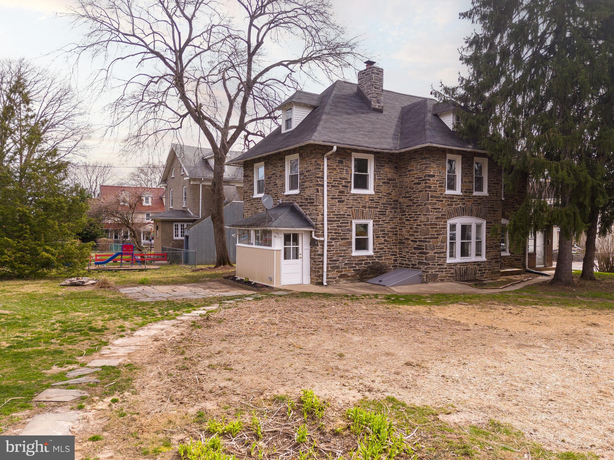 112 East Township Line Road Havertown, PA 19083 - Photo 23 of 40 a front view of a house with a yard