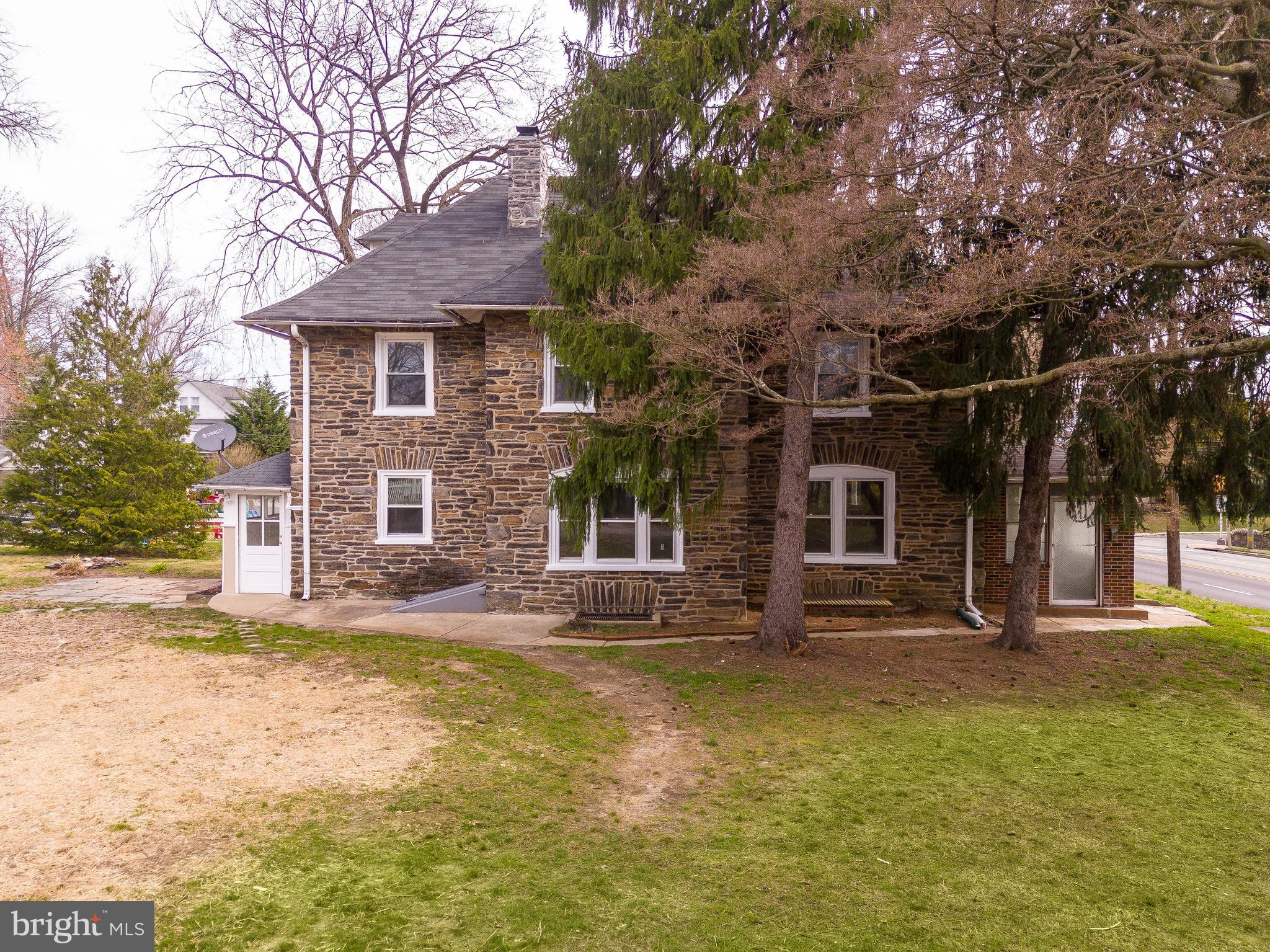 112 East Township Line Road Havertown, PA 19083 - Photo 29 of 40 a front view of a house with a garden