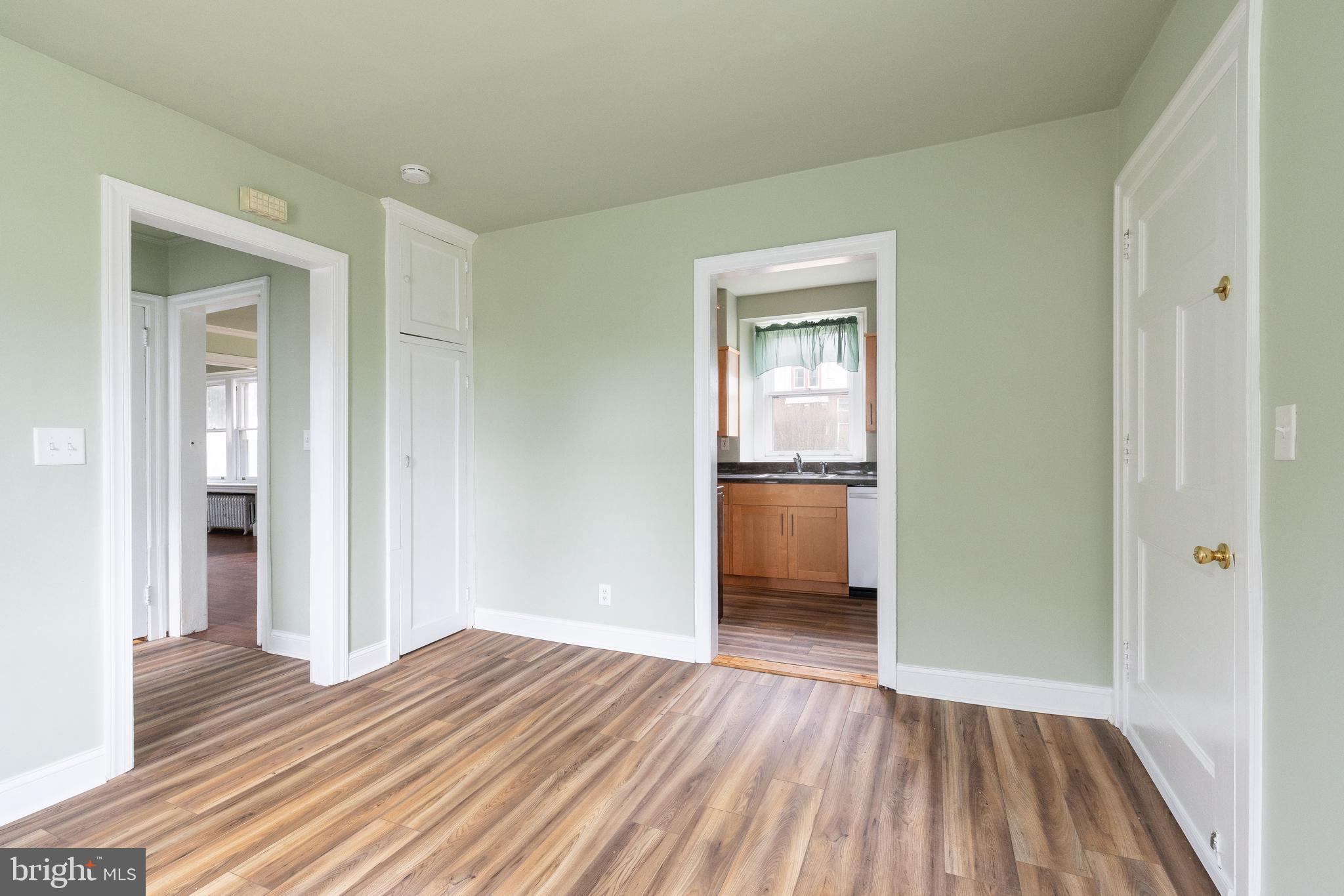 112 East Township Line Road Havertown, PA 19083 - Photo 3 of 40 a view of a room with wooden floor and a kitchen