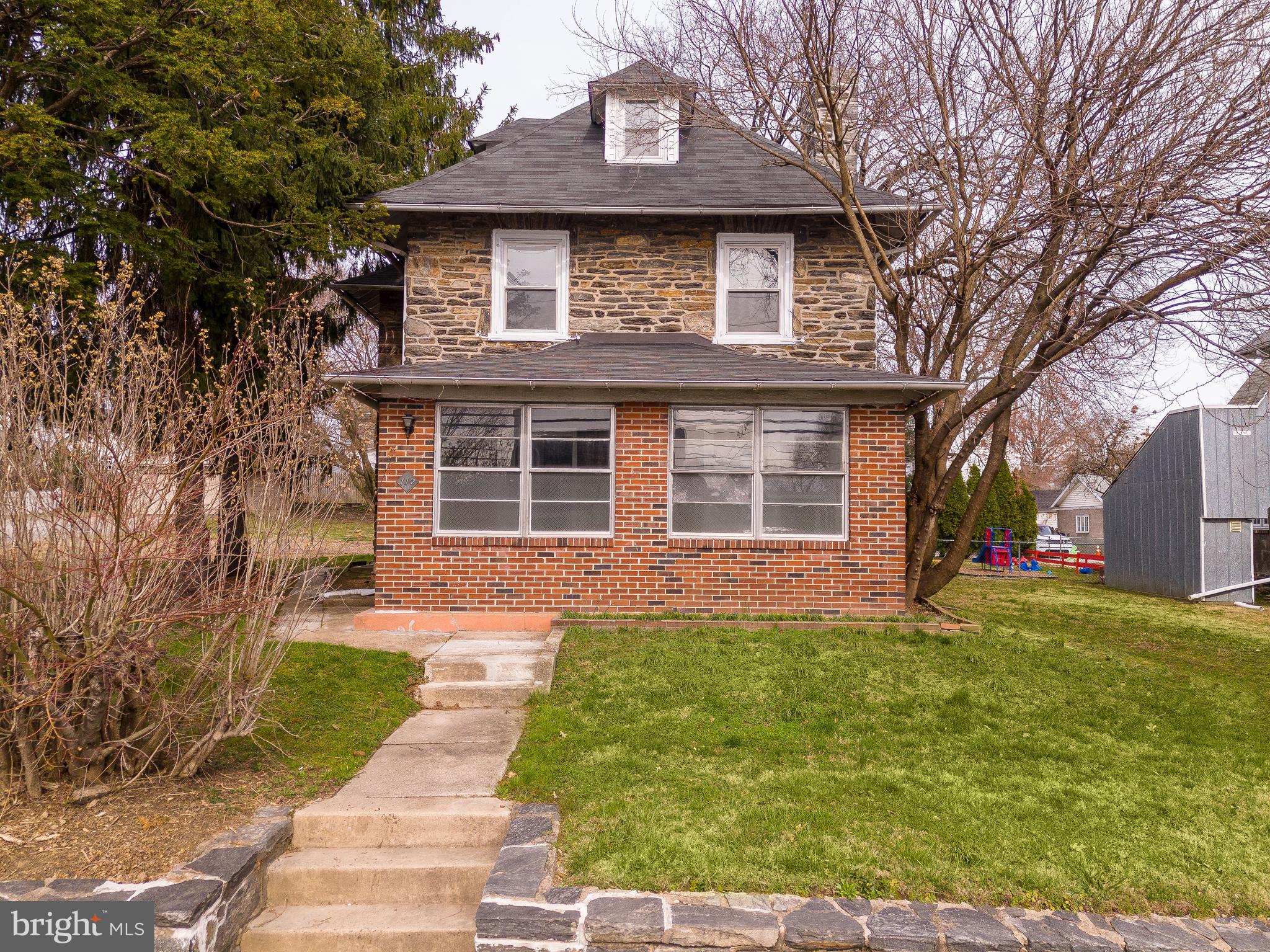112 East Township Line Road Havertown, PA 19083 - Photo 32 of 40 a front view of a house with a yard