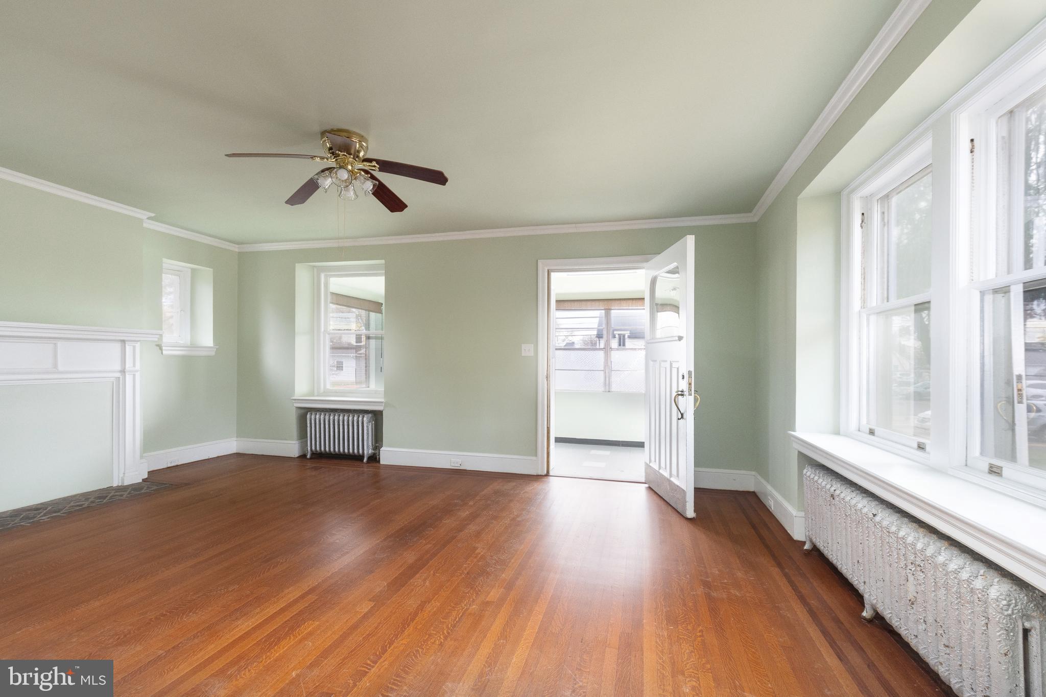 112 East Township Line Road Havertown, PA 19083 - Photo 6 of 40 a view of an empty room with wooden floor and a window
