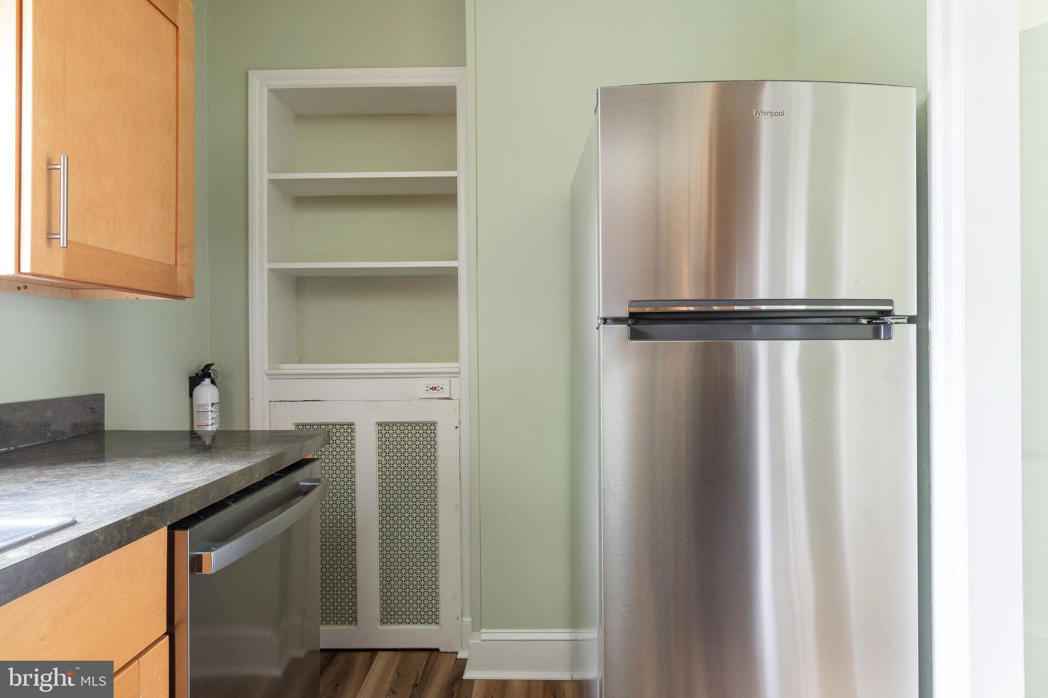 112 East Township Line Road Havertown, PA 19083 - Photo 9 of 40 a kitchen with a refrigerator and cabinets