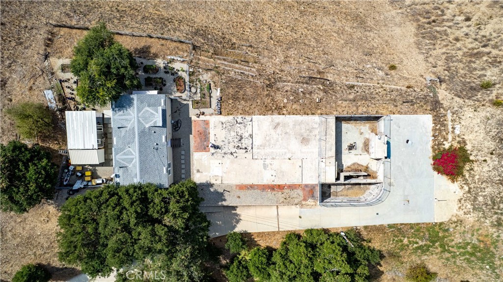 5767 Latigo Canyon Road Malibu, CA 90265 - Photo 21 of 54 aerial shot of the existing foundation, the footings, the house and the storage room.