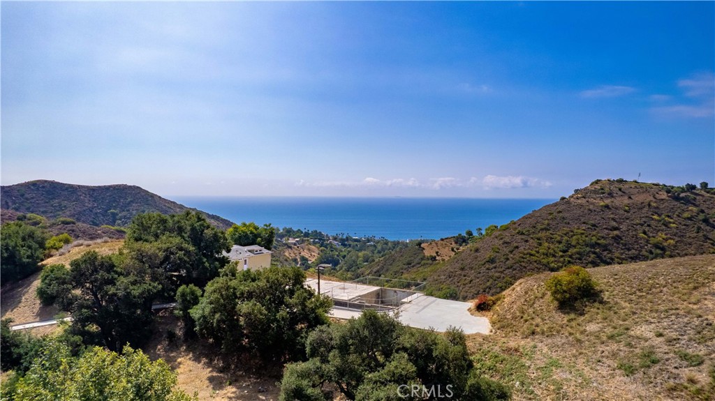 5767 Latigo Canyon Road Malibu, CA 90265 - Photo 26 of 54 Aerial view of the site, the foundation, the footings, the house and the ocean