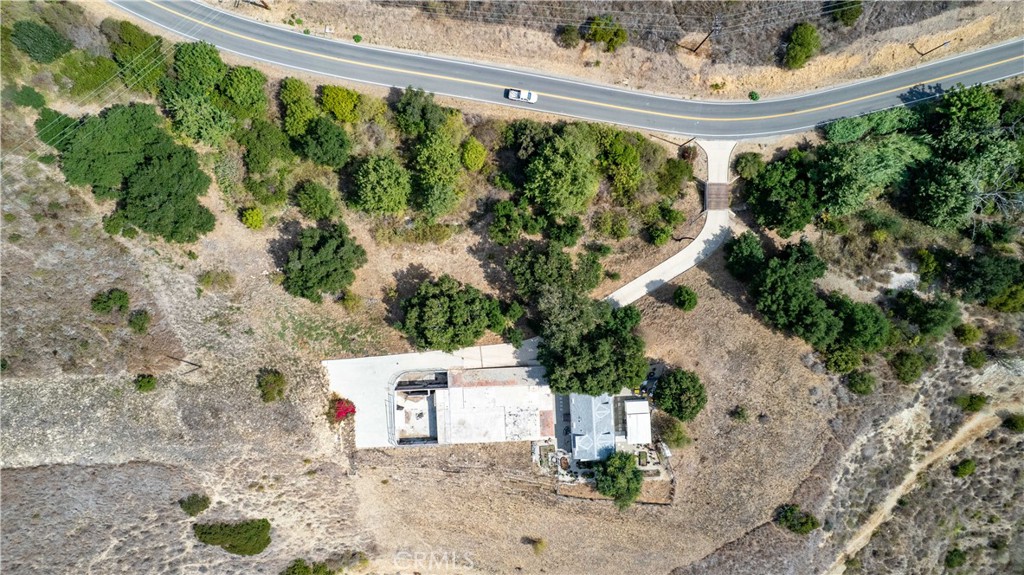 5767 Latigo Canyon Road Malibu, CA 90265 - Photo 32 of 54 Aerial shot of the site showing the foundation, the footings, the house and the storage room.