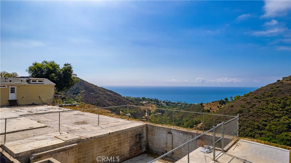 5767 Latigo Canyon Road Malibu, CA 90265 - Photo 8 of 54 Partial view of the ocean and canyons and the foundation and footings, and the house