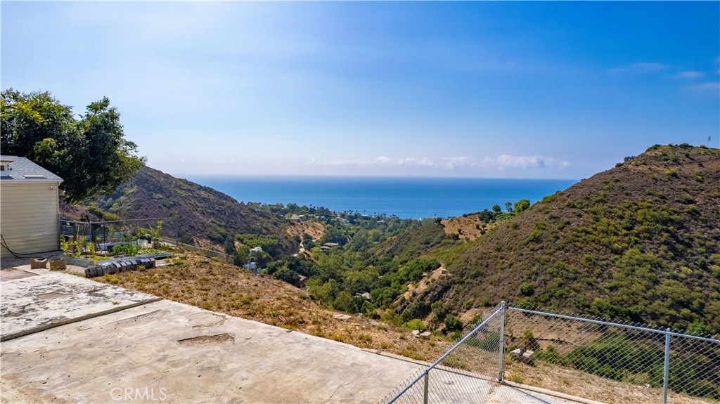 5767 Latigo Canyon Road Malibu, CA 90265 - Photo 10 of 54 Partial view of the ocean and canyons and the foundation, and the edge of the house