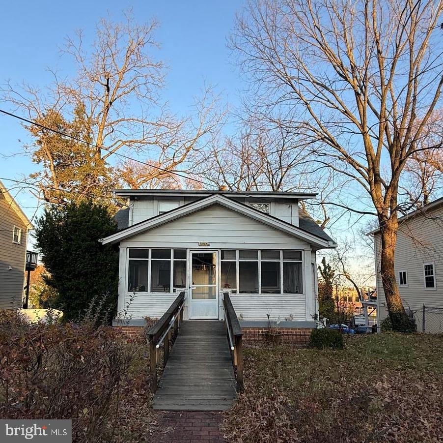 2137 30th Street Northeast Washington, DC 20018 - Photo 1 of 5 a front view of a house with a garden