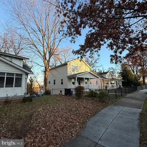 a view of house with a tree in front of it