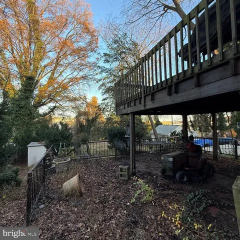 a view of a chairs and table in backyard