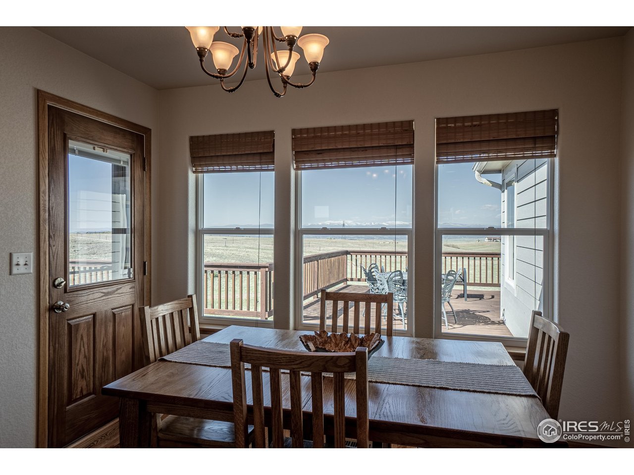 631 Linecamp Drive Livermore, CO 80536 - Photo 20 of 41 a view of a dining room with furniture wooden floor and a chandelier