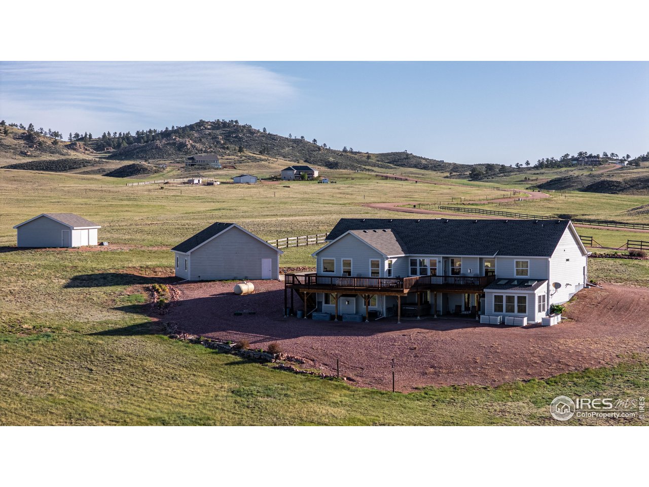 631 Linecamp Drive Livermore, CO 80536 - Photo 2 of 41 a aerial view of a house with big yard and large mountain view