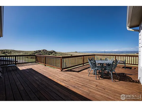 a view of deck with patio and dining space