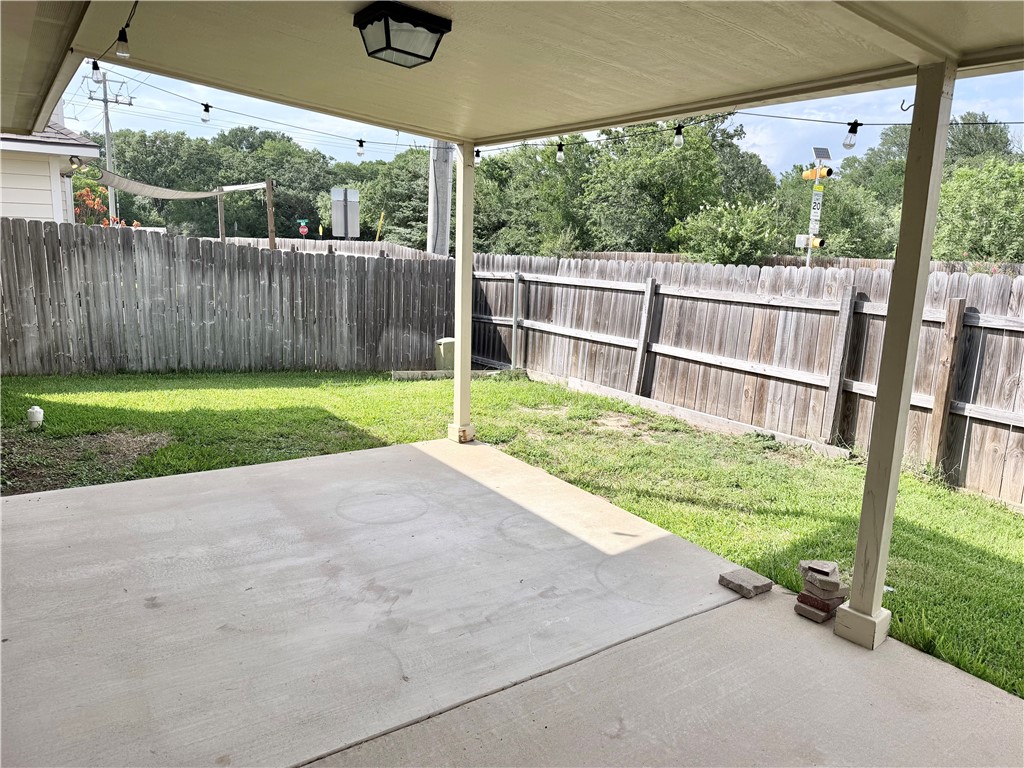 1029 Fallbrook Loop College Station, TX 77845 - Photo 28 of 34 a backyard of a house with grass and a large tree