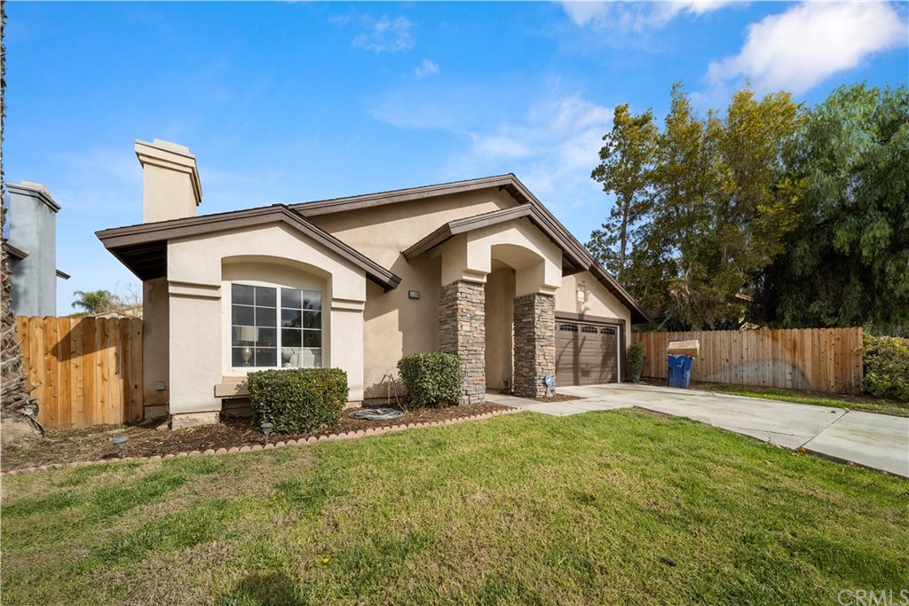 3259 Chase Road Riverside, CA 92501 - Photo 1 of 1 a front view of a house with a yard and potted plants