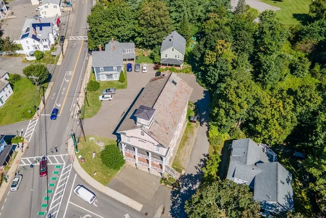 an aerial view of residential houses with outdoor space