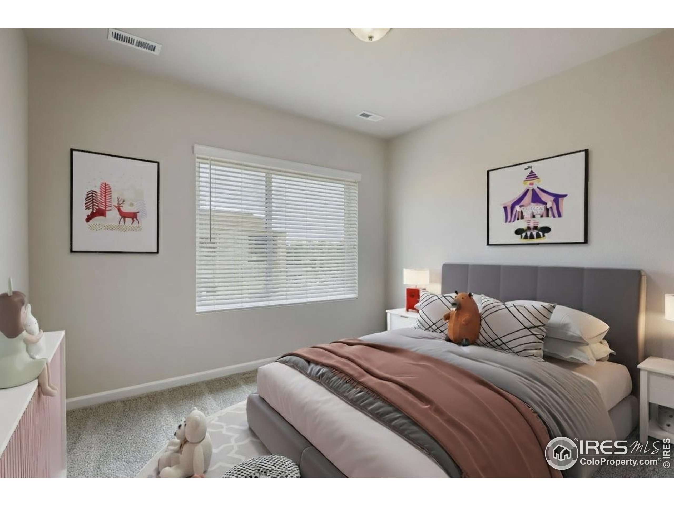 945 Abbott Lane, Unit 4 Fort Collins, CO 80524 - Photo 11 of 20 a bedroom with a bed and a painting on the wall