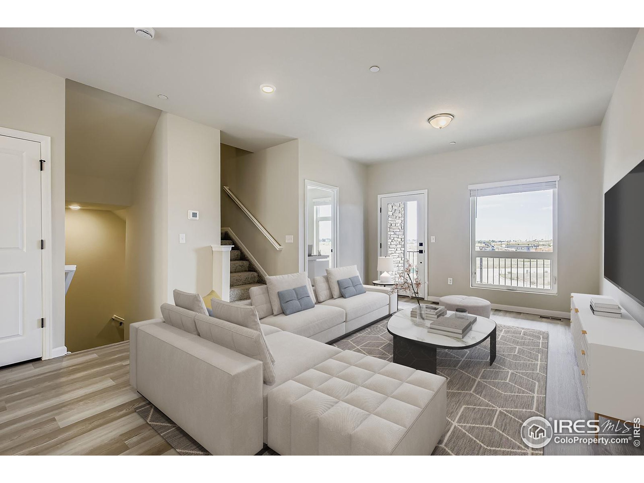 945 Abbott Lane, Unit 4 Fort Collins, CO 80524 - Photo 3 of 20 a living room with furniture and a flat screen tv