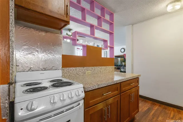 a kitchen with a stove and a microwave