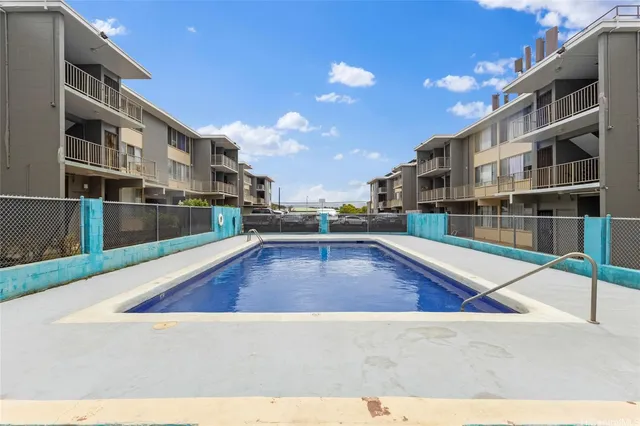 a view of a living room and kitchen