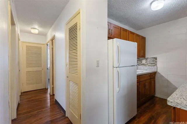 a view of hallway with wooden floor