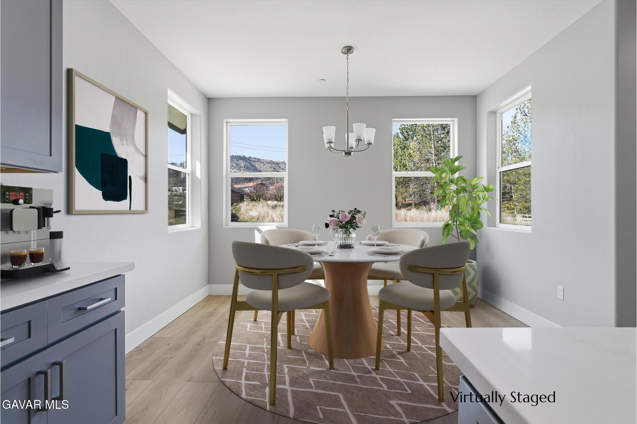 22613 Royal Place Tehachapi, CA 93561 - Photo 7 of 28 a view of a dining room with furniture and a window