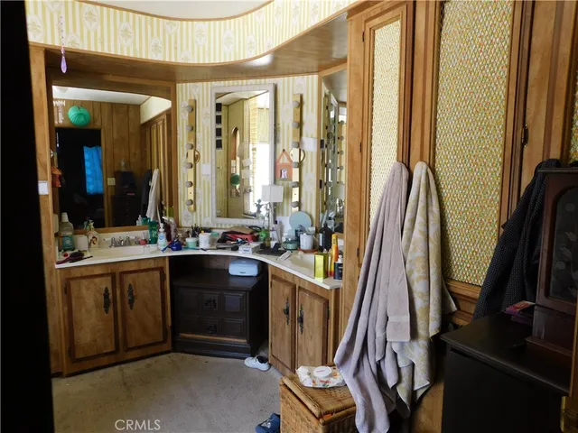 a view of a bathroom with dual sinks