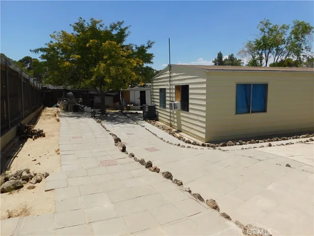 a view of a backyard of the house
