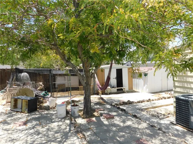 a view of a outdoor space with a patio and backyard