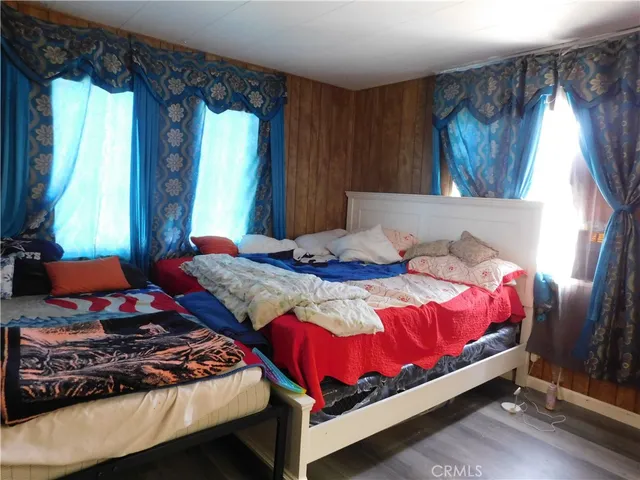 a bedroom with a bed and window