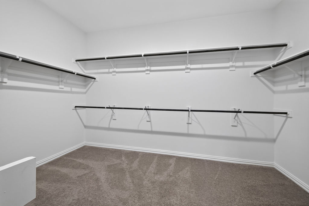 1332 Ridge Runner Drive Georgetown, TX 78628 - Photo 23 of 40 An organized closet offers ample shelving and hanging space for a streamlined wardrobe.