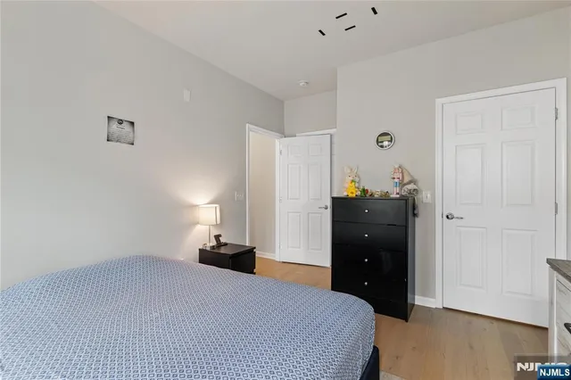 a bedroom with a bed and a closet