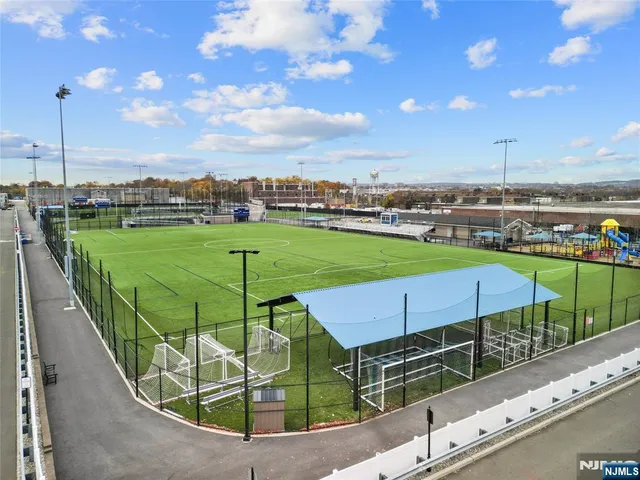 a view of a park with sitting area