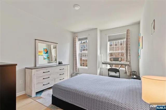 a bedroom with a bed and furniture