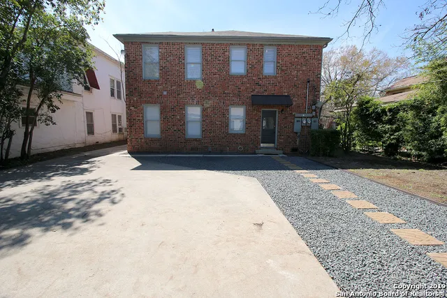 a view of house with backyard