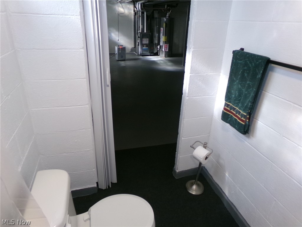 1912 Pickle Road Akron, OH 44312 - Photo 21 of 26 Bathroom with toilet and gas water heater