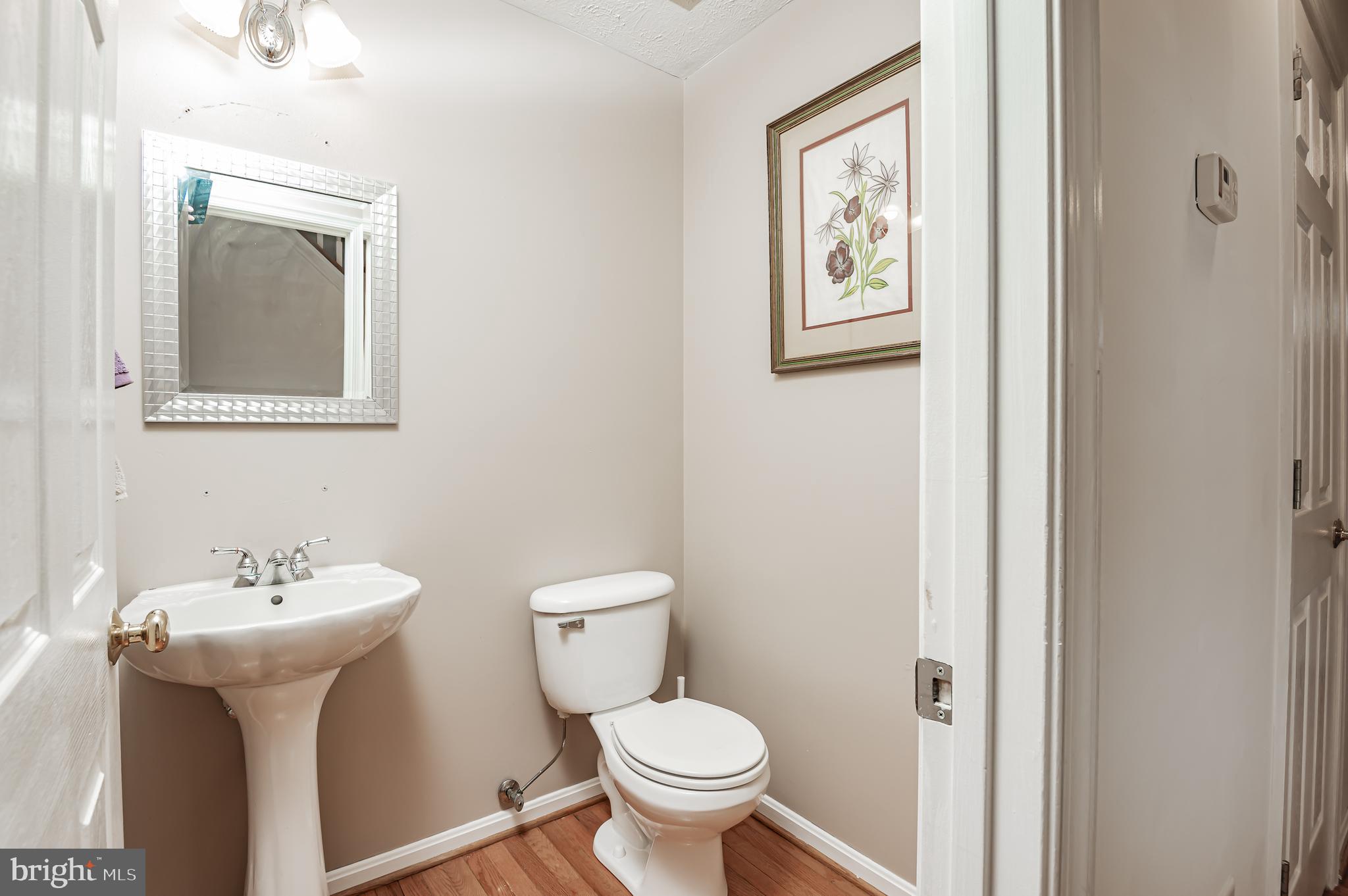 100 Surrey Drive Ruther Glen, VA 22546 - Photo 22 of 54 Powder Room with Hardwood Floors!