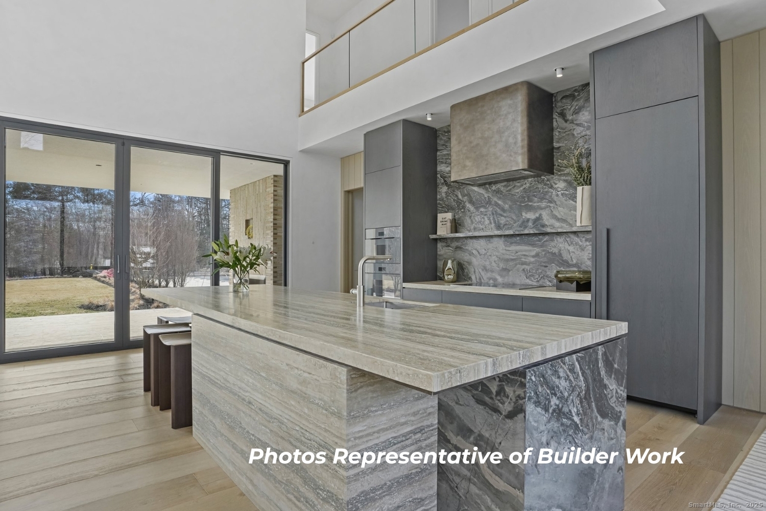 14 Burr School Road Westport, CT 06880 - Photo 9 of 16 a view of a kitchen with kitchen island a sink and living room view
