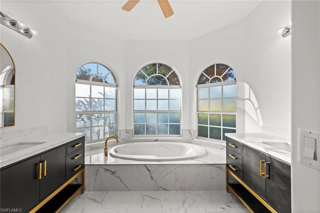 3972 Ruxton Road Naples, FL 34116 - Photo 19 of 41 a bath tub sitting next to a window