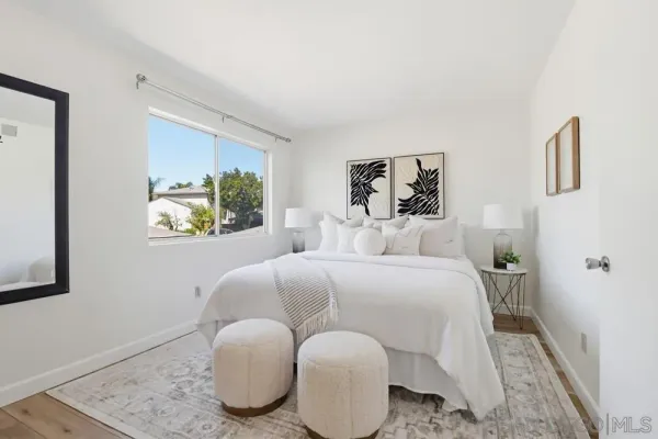a bedroom with a bed and couch