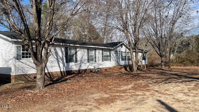 1959 Horseshoe Bend Road Erwin, NC 28339 - Photo 19 of 23 a house with trees in front of it