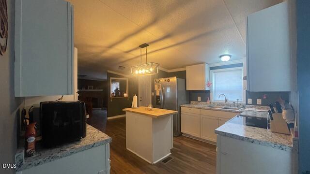 1959 Horseshoe Bend Road Erwin, NC 28339 - Photo 6 of 23 a kitchen with stainless steel appliances granite countertop a sink stove and refrigerator